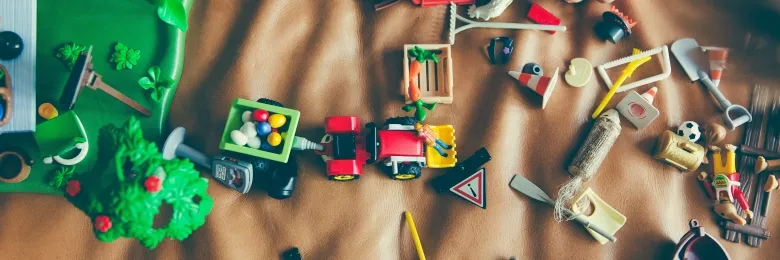 Assorted toys on top of a sheet