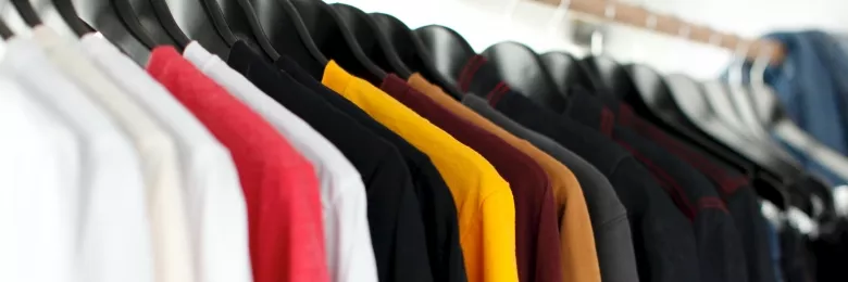 Clothes hanging up in a closet
