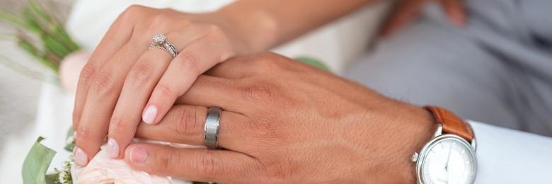 Married couple holding hands