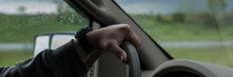 Person driving a car