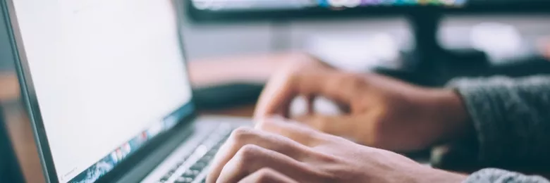 Person typing on a laptop