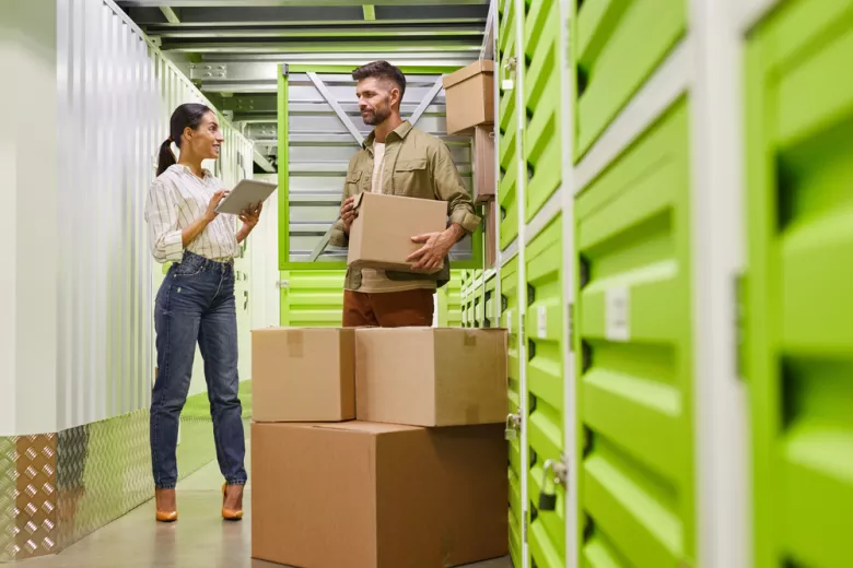 Businesspeople outside storage unit