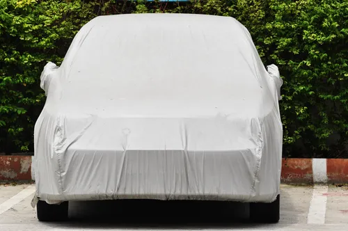 Covered car in outdoor storage