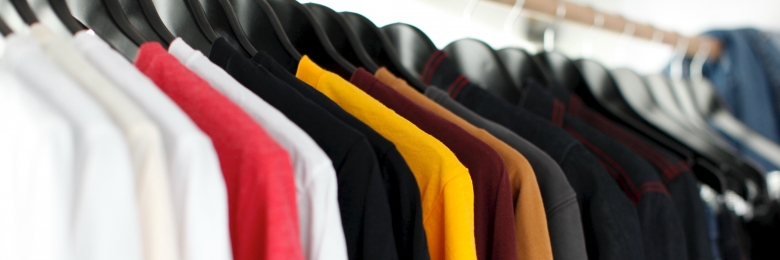 Shirts in closet Shirts hanging neatly in a closet