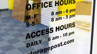 Photo of door at Storage Post self-storage, indicating daily access hours