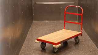 A red Storage Post hand cart